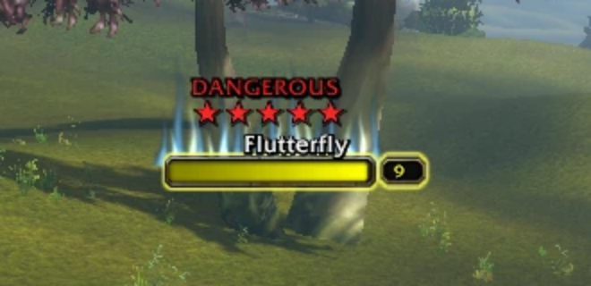 A nameplate with DANGEROUS, five red stars and blue fire rising behind the name